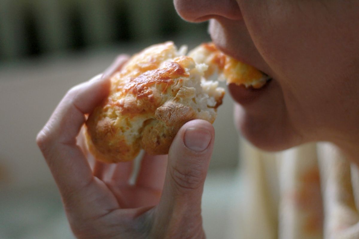 person eating bread food habits for oral care