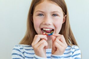 child wearing orthodontic retainer