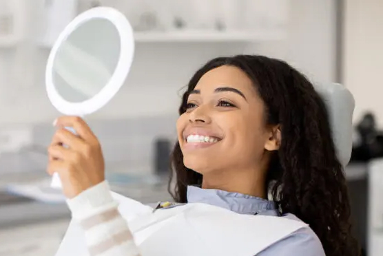 lady smiling after teeth whitening treatment lady smiling after teeth whitening treatment