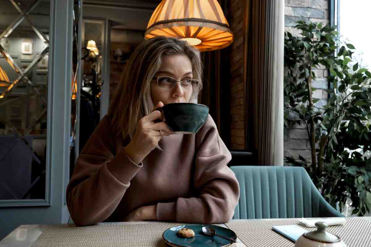 Woman drinking tea in cafe Woman drinking tea in cafe
