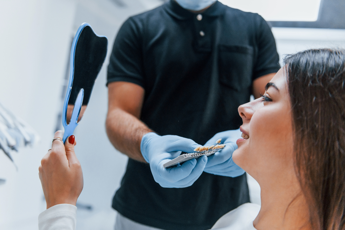 Austin dentist discussing a personalized dental treatment plan with a patient Austin dentist discussing a personalized dental treatment plan with a patient