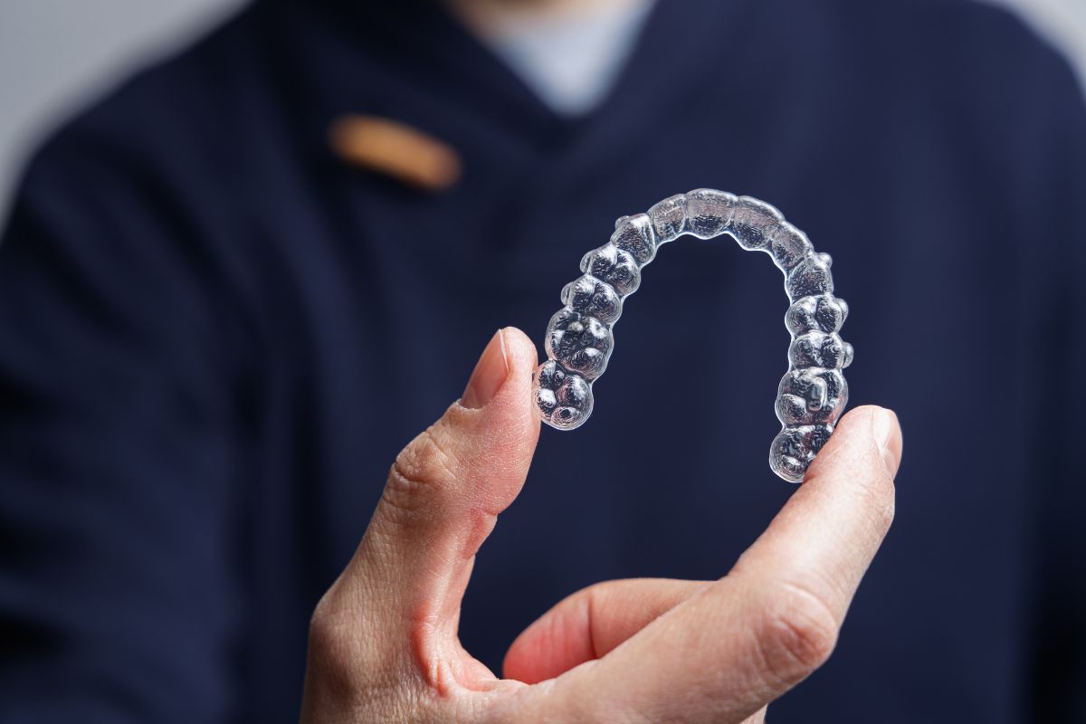 dentist showing invisalign clear aligner dentist showing invisalign clear aligner